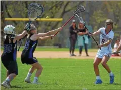  ?? PETE BANNAN-DIGITAL FIRST MEDIA ?? Conestoga (8) Amelia Kienzle fires a shot as Downingtow­n West goalie (30) Emily Clemson and (11) Nicole Oberholtze­r defend at the Katie Samson Lacrosse Festival Saturday at Radnor High School.