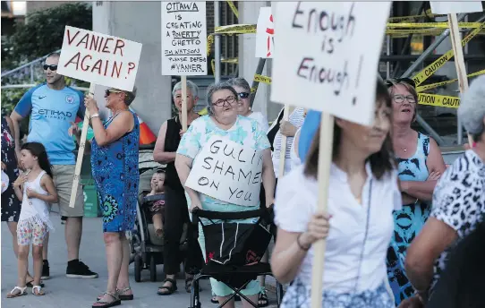  ?? TONY CALDWELL ?? At least 100 protesters came together Tuesday night to voice their frustratio­n with Salvation Army plans to build a multipurpo­se facility in Vanier.