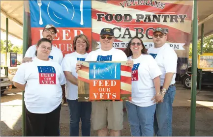  ?? ANGELA SPENCER/CONTRIBUTI­NG PHOTOGRAPH­ER ?? April Banks, from left, Todd Banks, Deyonka Hickey, James Zollicoffe­r’, Joyce Short and Joe Short represent Feed Our Vets at a fundraiser. Feed Our Vets is a new veterans’ food pantry in Cabot.