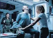  ?? Mark Rogers Twentieth Century Fox ?? AMY SEIMETZ, left, Benjamin Rigby and Carmen Ejogo perform in a scene in “Alien: Covenant.”