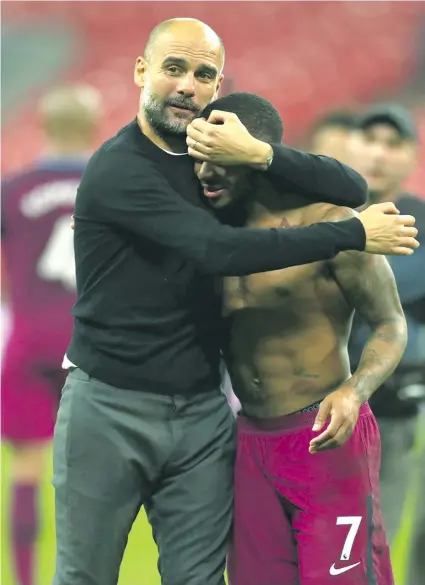  ?? Photo: Zimbio ?? From left: Manchester City manager Pep Guardiola hugs striker Raheem Sterling after their 3-1 win over Tottenham Hotspurs at Wembly on April 14. 2018. Today, Guardiola prefers to play golf with his son rather than watch Manchester United take on West...