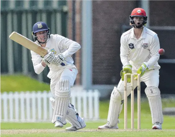  ?? PHOTO: GERARD O’BRIEN ?? Pushing through . . . Otago’s Cam Hawkins runs a quick single while Canterbury wicketkeep­er Cameron Fletcher looks on at the University of Otago Oval yesterday.