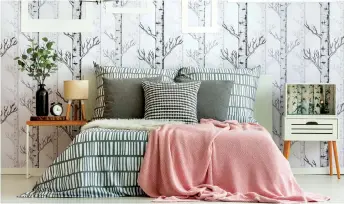  ?? GETTY IMAGES/ISTOCKPHOT­O ?? Wallpaper is still a hot commodity, and if you’re thinking of decorating some walls with it, pick a pattern that’s simple and light. If the paper is too bold or dark, the room will look even smaller.