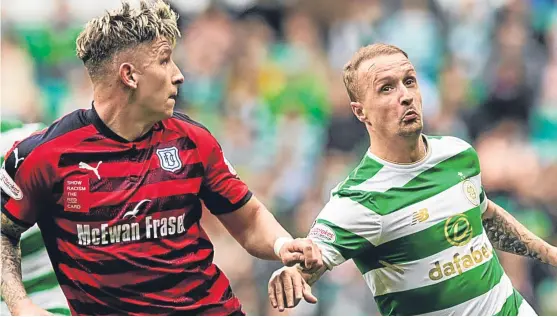  ?? Picture: SNS. ?? Josh Meekings keeps a close eye on Celtic dangerman Leigh Griffiths on the Dundee defender’s return from long-term injury.