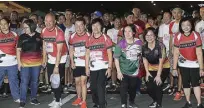  ??  ?? CSC officials, headed by Chairperso­n Alicia dela Rosa-Bala (middle) and Commission­er Leopoldo Roberto Valderosa,ww Jr. (third from left), prepare to run with the 3K participan­ts during the R.A.C.E. to Serve Fun Run held on Sept. 2 at the Quirino Grandstand, Manila.