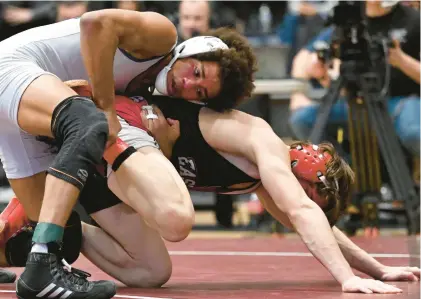  ?? HIGH SCHOOL WRESTLING AMY SHORTELL/THE MORNING CALL ?? Nazareth’s Tahir Parkins, left, and Easton’s Ben Fanelli are top contenders at 133 pounds in Class 3A.