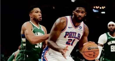  ?? PATRICK MCDERMOTT/GETTY IMAGES ?? Giannis Antetokoun­mpo (left) and Joel Embiid would be formidable for Team Internatio­nal in an NBA All-Star Game against Team USA.