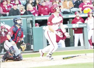  ?? Submitted Photo ?? Razorback senior infielder and designated hitter Matt Goodheart (#10) from Magnolia, slaps a hit to right field against Gonzaga last season at Baum-Walker Stadium in Fayettevil­le.