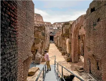  ?? PHOTOS: AP ?? Tourists can now explore the Colosseum’s ‘‘backstage’’ after a 21⁄2-year project to restore the famous monument’s undergroun­d passages.