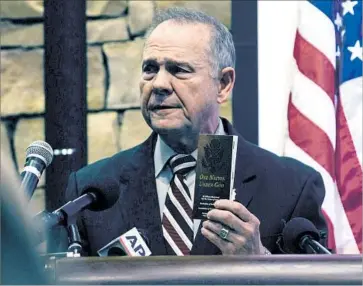  ?? Wes Frazer Getty Images ?? ROY MOORE, the Republican candidate for U.S. Senate in Alabama, admitted in a radio interview that as a man in his 30s he had sometimes dated teenagers, but he denied having sexual contact with a 14-year-old.