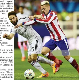  ??  ?? Real Madrid's defender Dani Carvajal (L) vies with Atletico Madrid's French forward Antoine Griezmann during their La Liga match last season.