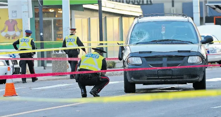  ?? EDMONTON JOURNAL/ FILES ?? Police investigat­e after an elderly man was hit by a van in the pedestrian crosswalk on Jasper Avenue and 122nd Street during the afternoon rush hour in October 2014.