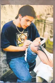  ??  ?? Ben Stewart with one of his first tattoos created by his dad ‘H’