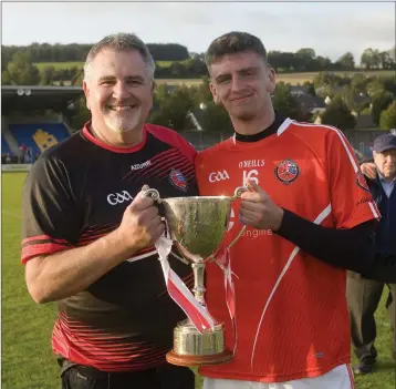  ??  ?? Proud moment! Ryan Willoughby with his dad, Richard, after the final whistle.