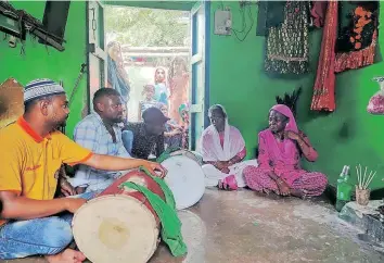  ?? | Sayan Dey ?? SIDDIS performing Baithaaki (sitting) Dhamaal in a shrine in Gujarat.