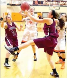  ?? RANDY MOLL NWA MEDIA ?? Ashtyn Rothrock kicks a leg up while jostling for a rebound against Gravette. The Lady Wolves won 61-36 on Dec. 16 to open league play with a victory.