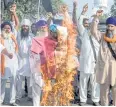  ?? AFP ?? Farmers burn an effigy of PM Narendra Modi on Saturday.