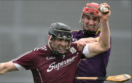  ??  ?? Paul Morris challengin­g Galway’s Aidan Harte during Wexford’s vital National League victory in Salthill in February.