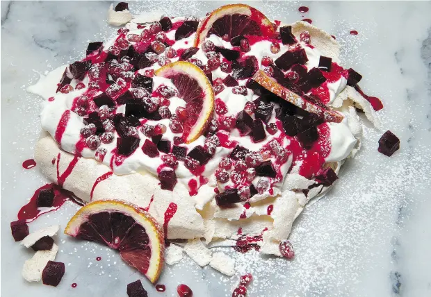  ?? PETER J. THOMPSON / NATIONAL POST ?? Bonnie Stern’s Valentine’s Day Pavlova with Candied Beets and Pomegranat­e.