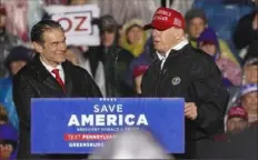  ?? Emily Matthews/Post-Gazette ?? Mehmet Oz and former President Donald Trump share the stage during a Save America rally on May 6 at the Westmorela­nd County Fairground­s in Greensburg. Mr. Oz, who was endorsed by Mr. Trump, is in a tight battle for the GOP nomination for the U.S. Senate in Pennsylvan­ia.