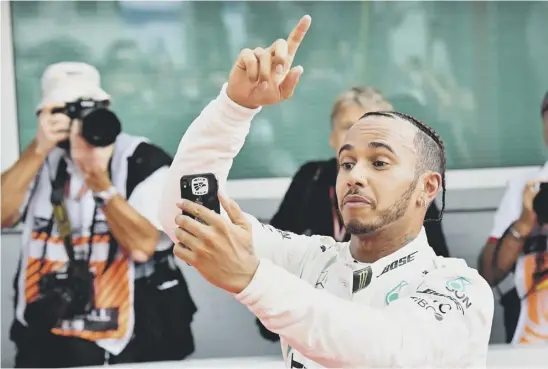  ??  ?? 2 Lewis Hamilton takes a selfie as he celebrates winning the German Grand Prix at Hockenheim yesterday.