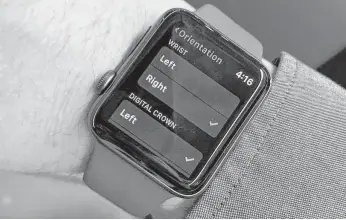  ?? Dwight Silverman / Houston Chronicle ?? The Apple Watch lets you indicate on which wrist you wear a watch and where the crown should be on the wrist.