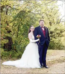  ?? CONTRIBUTE­D ?? Erika Slifer and her husband, Ted Mendenhall, on their wedding day in October of 2020. Though mostly wheelchair bound, Slifer can stand for short periods. The couple is working with a surrogate to have a baby of their own.