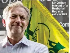  ??  ?? Mr Corbyn in front of a Hezbollah flag at a rally in 2012