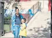  ?? JEENAH MOON — THE NEW YORK TIMES ?? Vaniqua Hudson-Figueroa and her daughter, Mia Issabela, outside Public School 151 in Queens. The city’s $100 deposit in a college savings account could pay dividends.