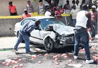  ?? FILE ?? Onlookers gather at the scene of a motor vehicle accident along Mountain View Avenue in Kingston on February 23, 2015. Eyewitness­es said the car ran into the back of another vehicle travelling in the same direction.