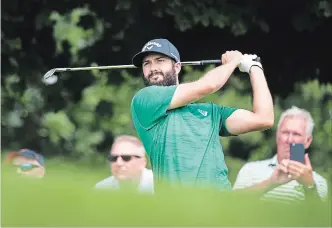  ?? NATHAN DENETTE THE CANADIAN PRESS ?? Canadian Adam Hadwin watches his tee shot on the seventh hole during the pro-am ahead of the Canadian Open at the Glen Abbey Golf Club in Oakville on Wednesday.