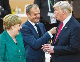  ?? RYAN REMIORZ / THE CANADIAN PRESS VIA AP ?? United States President Donald Trump (right) has a laugh with German Chancellor Angela Merkel (left) and European Council President Donald Tusk before the third working session at the G-20 summit Saturday.