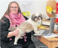  ??  ?? Reaching out Online tutor Shona Moncrieff and dog Coco in her St Fillans home