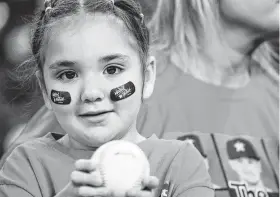 ?? Karen Warren / Staff file photo ?? Lilliana Cardoza, a 5-year-old Astros fan whose parents were married at Minute Maid Park, said of the team: “They are my friends, because they win every time.”