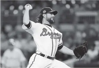  ?? THE ASSOCIATED PRESS ?? Atlanta’s R.A. Dickey pitches against the Philadelph­ia Phillies during the seventh inning of Thursday’s game in Atlanta. The Braves won 3-1.