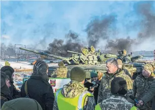  ?? MYKOLA LAZARENKO AFP/GETTY IMAGES ?? Ukrainian President Petro Poroshenko imposed martial law in 10 regions for 30 days.