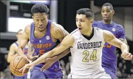  ?? MARK HUMPHREY / AP ?? Florida’s two losses to Vanderbilt (17-14) are the main reason ESPN bracketolo­gist Joe Lunardi sees the Commodores making the NCAA Tournament.