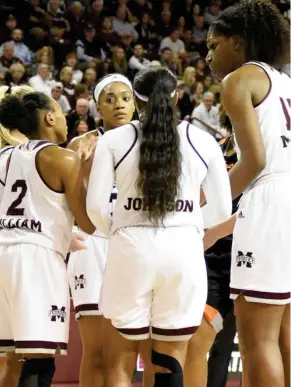  ?? (Photo by Jason Cleveland, SDN) ?? Mississipp­i State leaders Blair Schaefer, left blocked out, Morgan William (2), Victoria Vivians, middle, Roshunda Johnson, second from right, and Teaira McCowan, right, huddle during Monday's game.