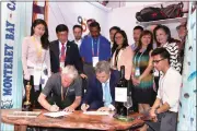  ?? Photo: Courtesy of California business delegation ?? California delegation signs contracts at CIIE