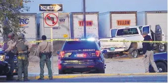  ?? ADOLPHE PIERRE-LOUIS/JOURNAL ?? Bernalillo County Sheriff’s deputies investigat­e the scene where Isaac Padilla and Martin Jim were shot to death in a stolen truck in November 2017.