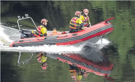  ?? Picture: Perthshire Picture Agency. ?? Water rescue specialist­s from the Scottish Fire and Rescue Service.