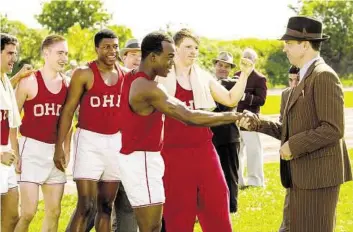  ?? Focus Features ?? Stephan James, center, and Jason Sudeikis, right, star in “Race.”