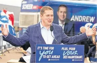  ?? SALTWIRE NETWORK ?? Conservati­ve Party of Canada Leader Andrew Scheer shows off his slogan in two official languages Thursday in Trois-rivières.