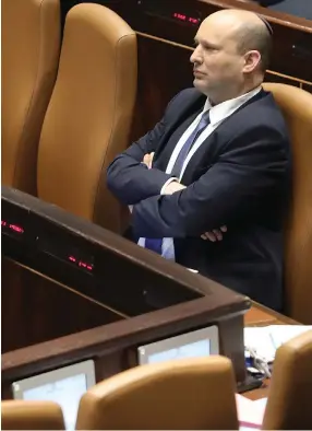  ?? (Marc Israel Sellem/The Jerusalem Post) ?? PRIME MINISTER Naftali Bennett sits in the Knesset this week.