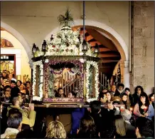  ?? Rick Steves’ Europe/RICK STEVES ?? In Nafplio, Greece, a symbolic Easter casket is carried in a funeral procession that winds through town.