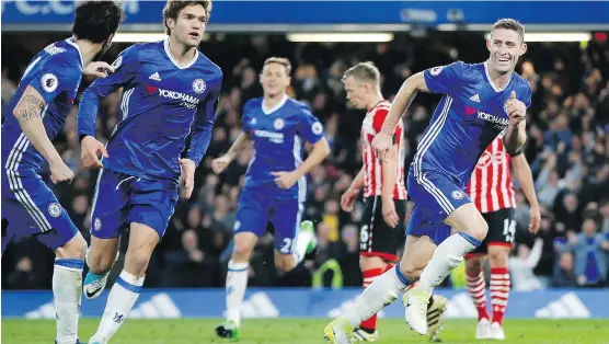  ?? ALASTAIR GRANT/THE ASSOCIATED PRESS ?? Chelsea has an opportunit­y to take the Premier League title for the second time in three years if it keeps its four-point lead or extends it..