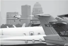  ?? ANDREW SCOTT/COURIER JOURNAL ?? A private jet arrives at Louisville Muhammad Ali Internatio­nal Airport on May 3.