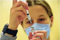  ?? KRISTOPHER RADDER/ASSOCIATED PRESS ?? Kayla Pendlebury prepares a children’s dose of the COVID-19 vaccine Saturday at Brattlebor­o Memorial Hospital in Vermont.