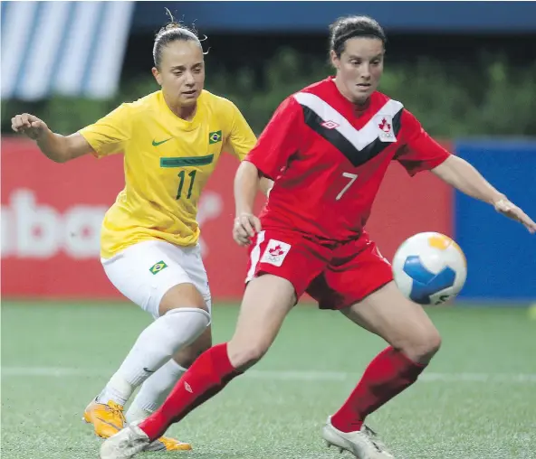  ?? —THE ASSOCIATED PRESS FILES ?? North Vancouver’s Rhian Wilkinson, right, makes her 181st and final appearance wearing Canadian colours on the soccer pitch Saturday during a senior women’s team friendly against Mexico at B.C. Place.