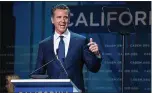  ?? BEN CHRISTOPHE­R FOR CALMATTERS ?? Gov. Gavin Newsom promised to deal with the twin problems of utility solvency and wildfire safety, and the result is legislatio­n that once again overhauls utility operations.